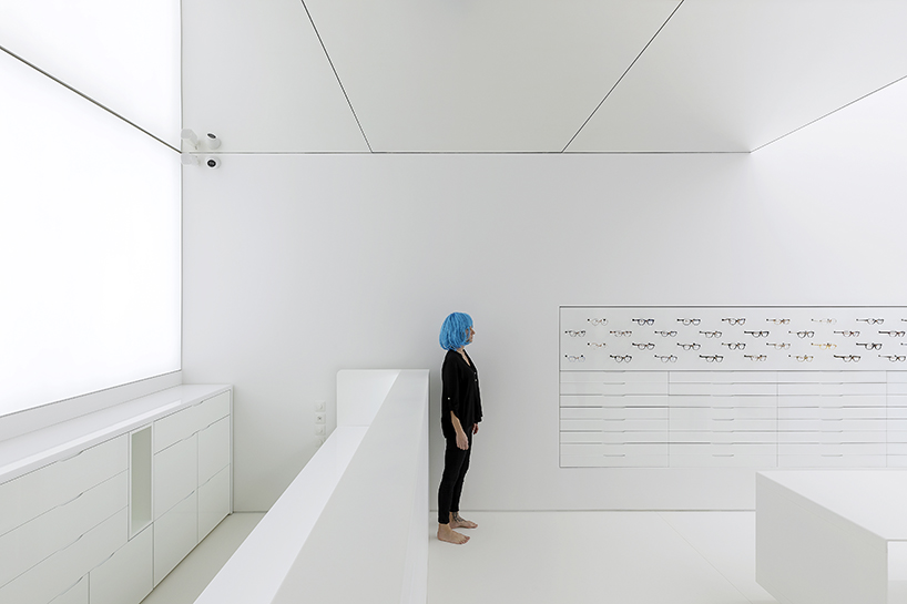 mold architects installs a metal curtain wall to display sunglasses in athens eyewear store designboom