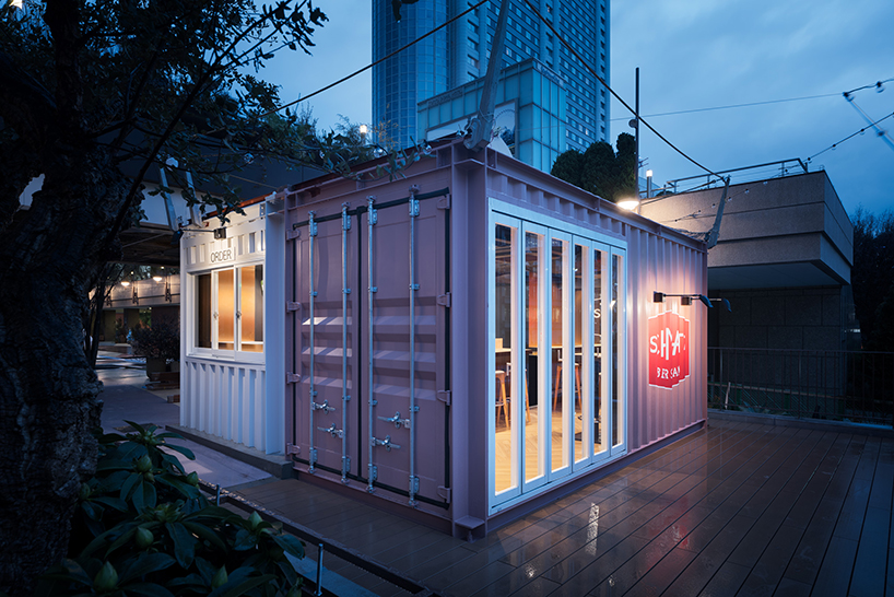 I IN repurposes a shipping container to form the SCHMATZ beer stand in tokyo designboom