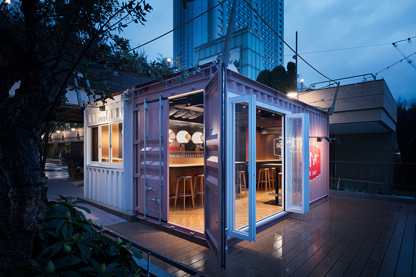 I IN repurposes a shipping container to form the SCHMATZ beer stand in tokyo designboom