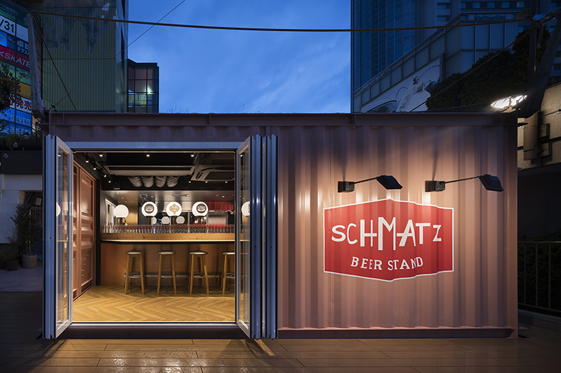 I IN repurposes a shipping container to form the SCHMATZ beer stand in tokyo designboom