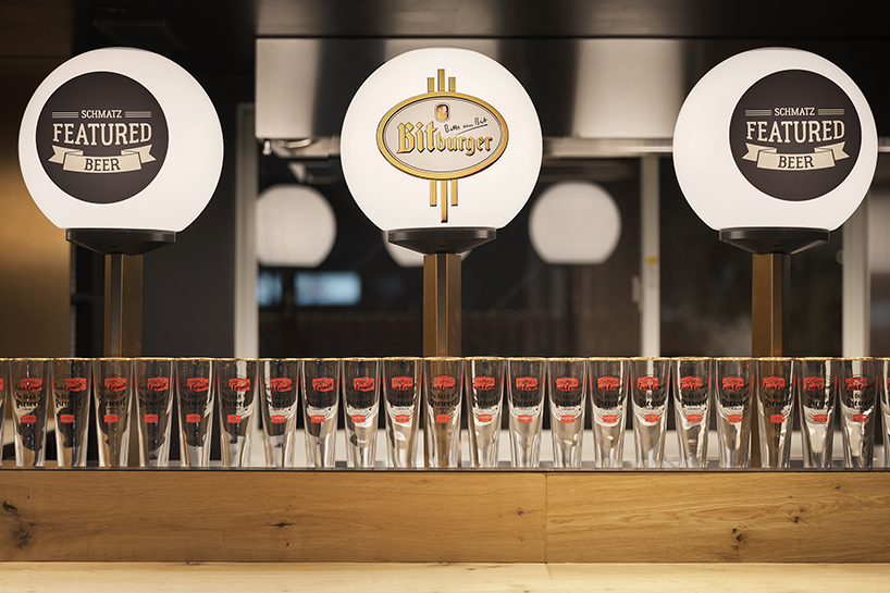 I IN repurposes a shipping container to form the SCHMATZ beer stand in tokyo designboom