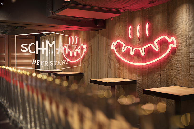 I IN repurposes a shipping container to form the SCHMATZ beer stand in tokyo designboom