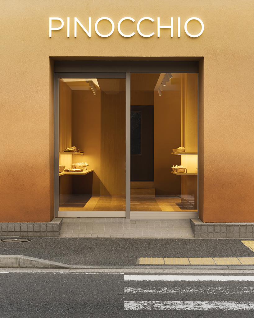 the color of baked bread adorns the façade of I IN's pinocchio bakery in japan designboom