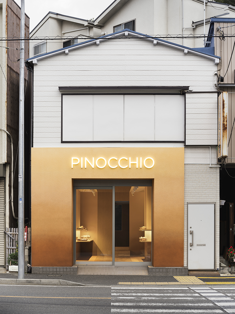 the color of baked bread adorns the façade of I IN's pinocchio bakery in japan designboom
