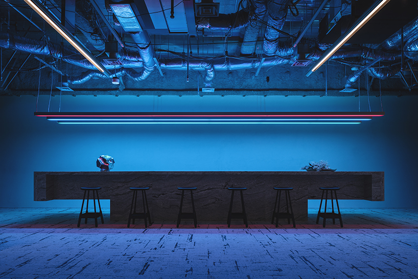 minimal lines & radiant fluorescent lighting enliven I IN’s futuristic office in tokyo