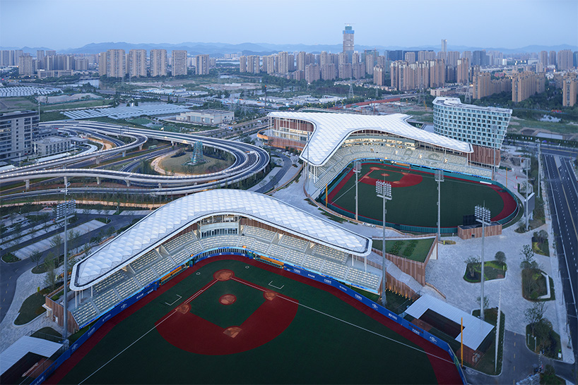 cloud-like winged roof floats above UAD's asian games sports cultural center in hangzhou