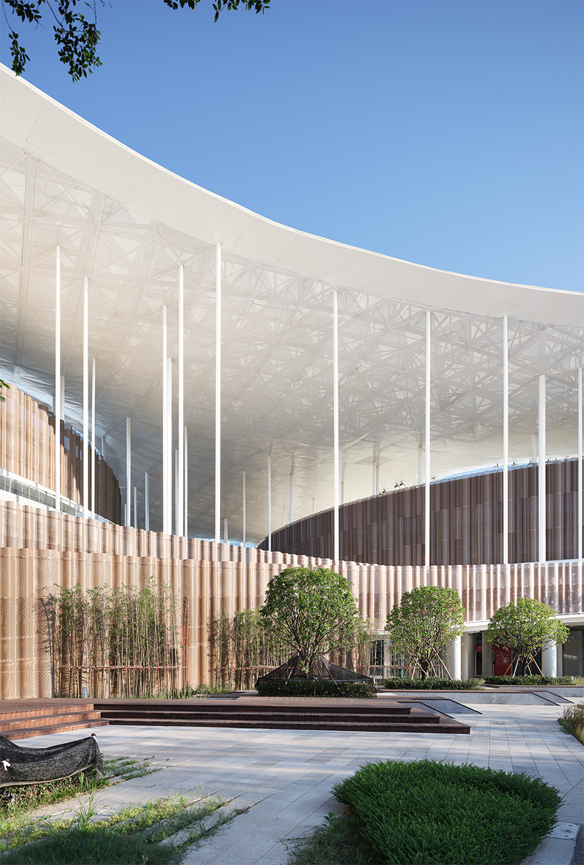 cloud-like winged roof floats above UAD's asian games sports cultural center in hangzhou