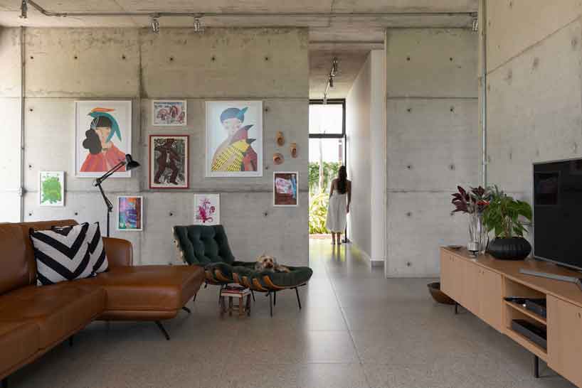 perforated brick facade punctuates fernanda padula’s concrete house in brazil