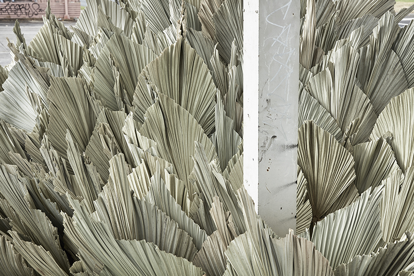 loose leaf studio takes over a disused petrol station with botanical installation designboom