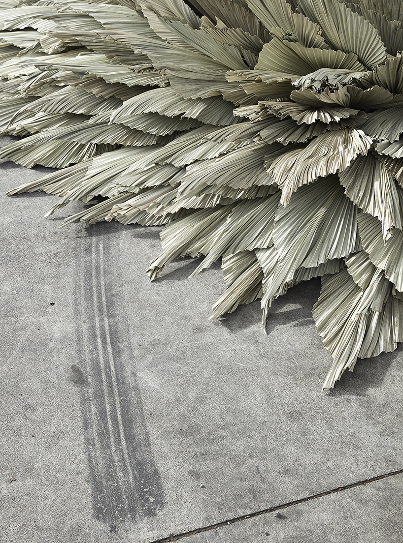 loose leaf studio takes over a disused petrol station with botanical installation designboom