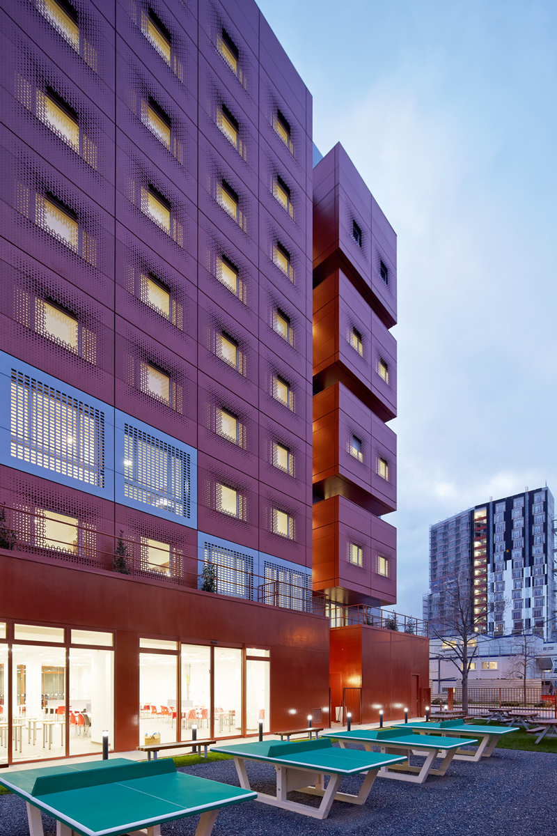 white & bright red perforated metal facade clads student housing by BFV in france