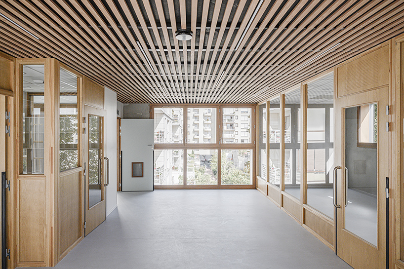 BFV architectes designs 'crèche justice' in paris using recycled door frames designboom