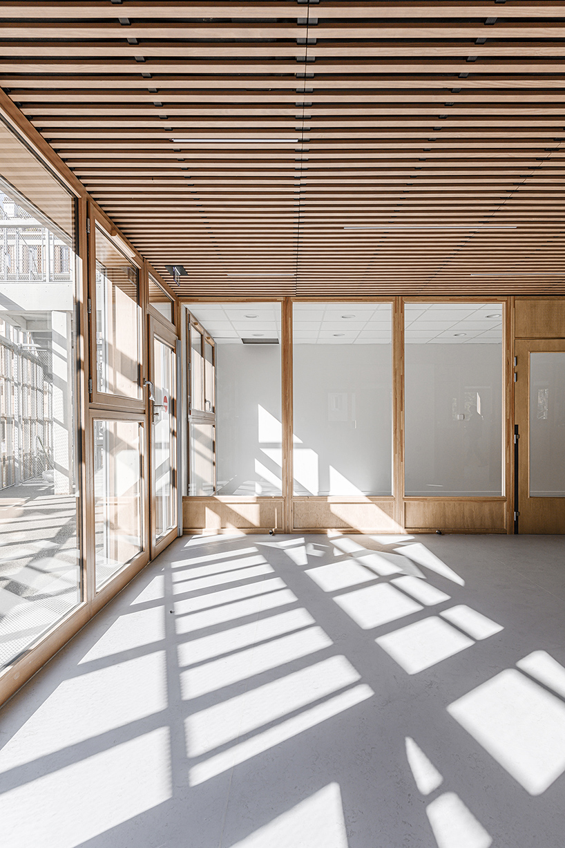 BFV architectes designs 'crèche justice' in paris using recycled door frames designboom