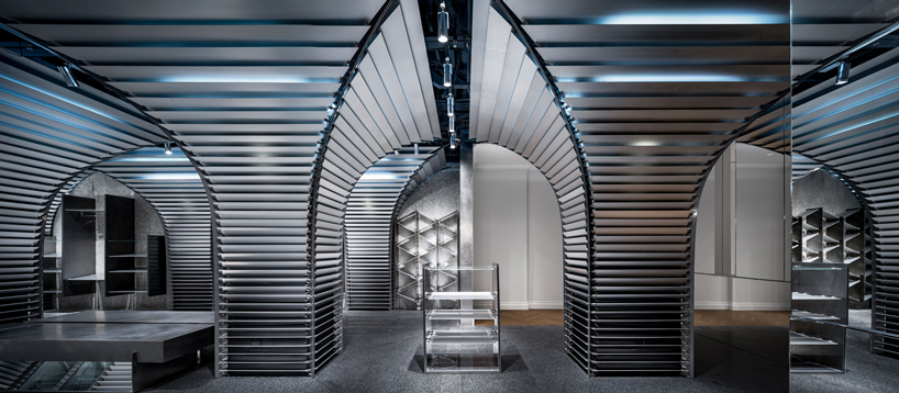 dongqi architects creates metal clad columns for concept store renovation in shanghai designboom
