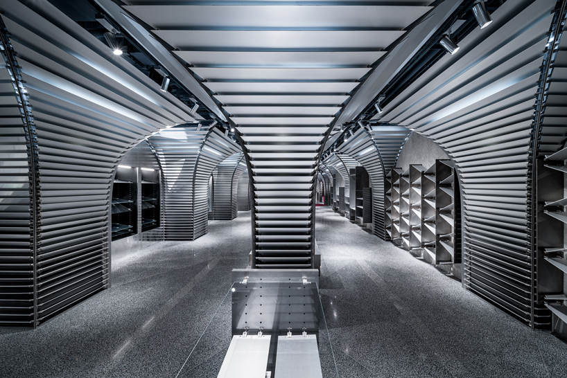 dongqi architects creates metal clad columns for concept store renovation in shanghai designboom