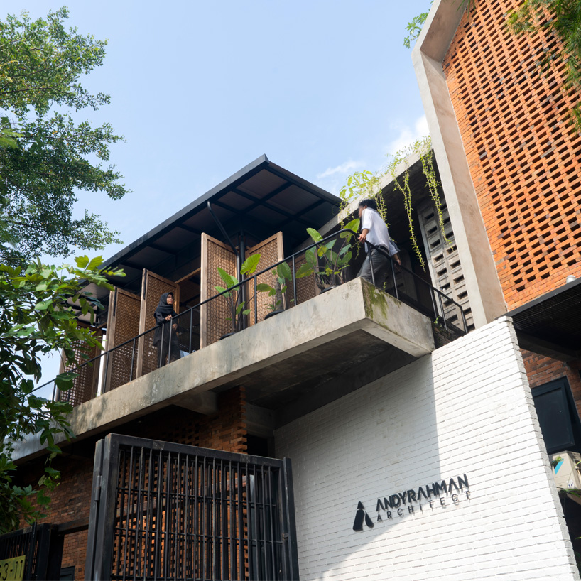 bamboo 'breathing walls' draw natural light in andyrahman's biophilic workspace in indonesia