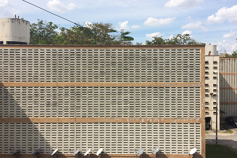leon leong recalls malaysia's 1960s public housing with 'cracks in the wall' exhibition designboom