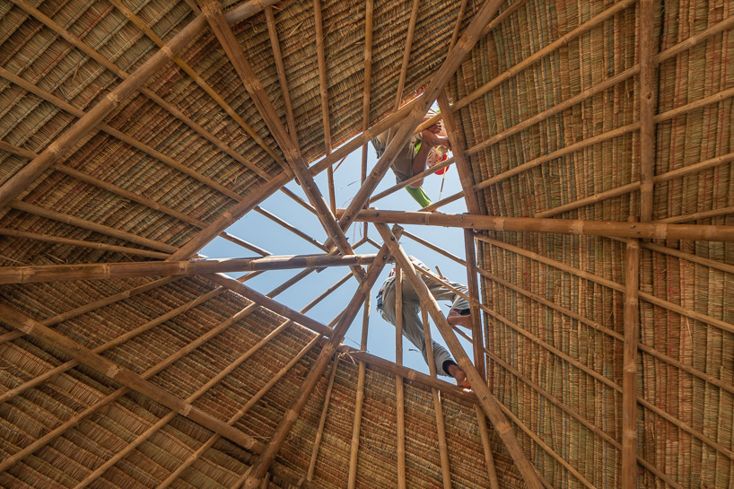 estudio cavernas builds a beach getaway using bettle nut palm trunks and bamboo on the shores of cambodia 12