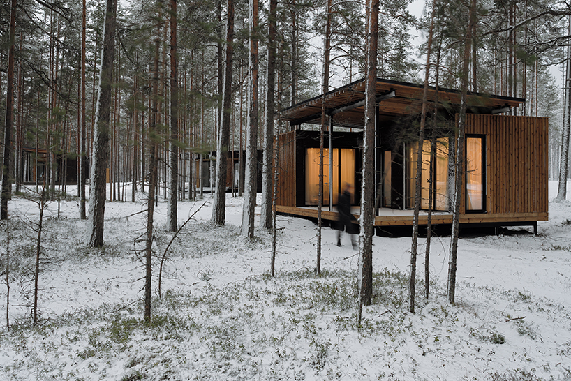 prefab cabin hotel by rhizome settles isolated within karelian landscape, in russia