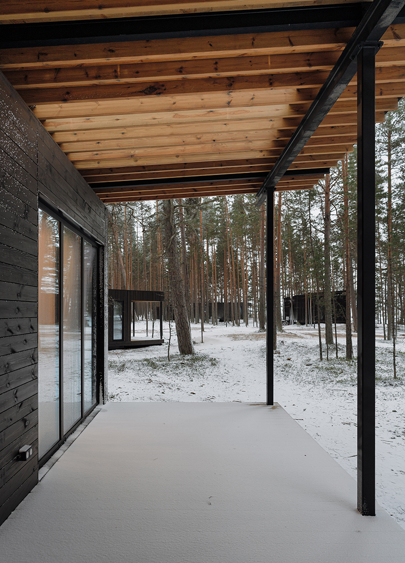 prefab cabin hotel by rhizome settles isolated within karelian landscape, in russia