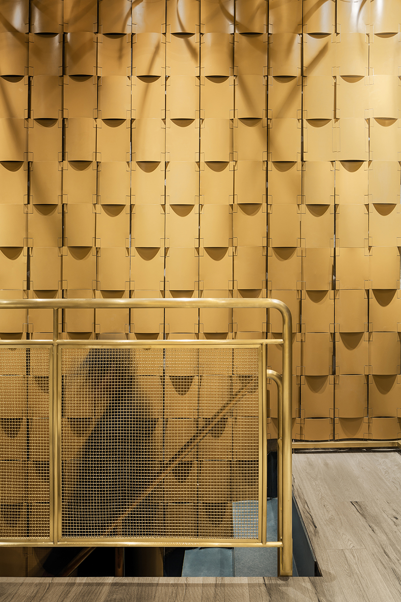 atelier tree brings life to beijing storefront with golden heart installation - 1