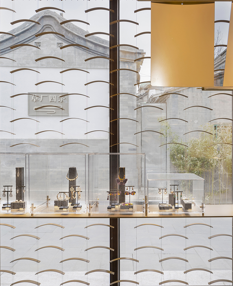 atelier tree brings life to beijing storefront with golden heart installation - 3