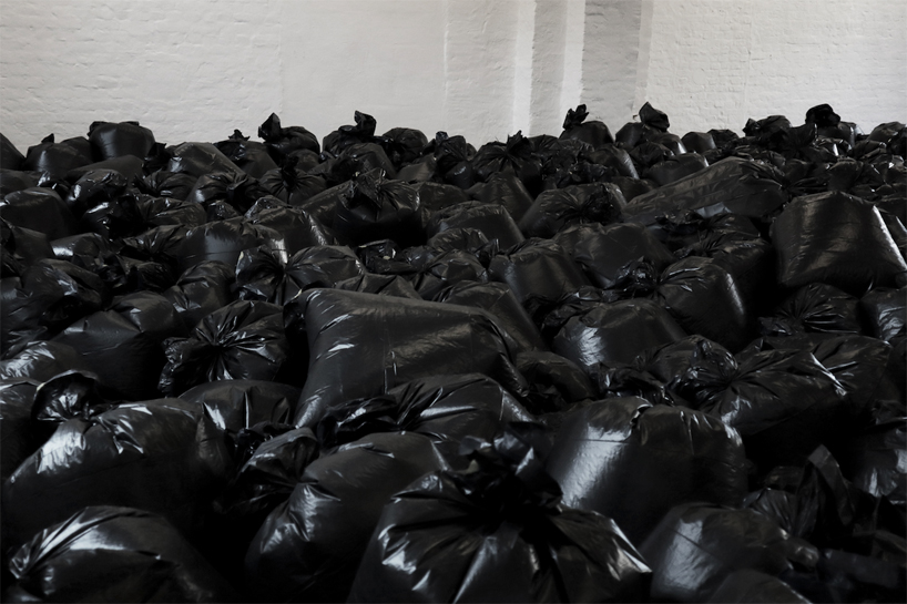 the krank installs 500 plastic trash bags in berlin to highlight our consumerist society designboom