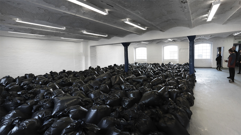 the krank installs 500 plastic trash bags in berlin to highlight our consumerist society designboom