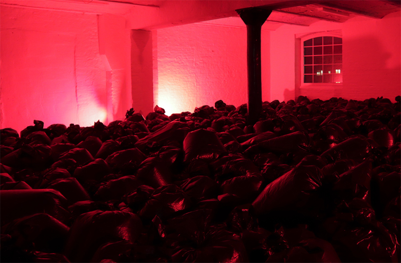 the krank installs 500 plastic trash bags in berlin to highlight our consumerist society designboom