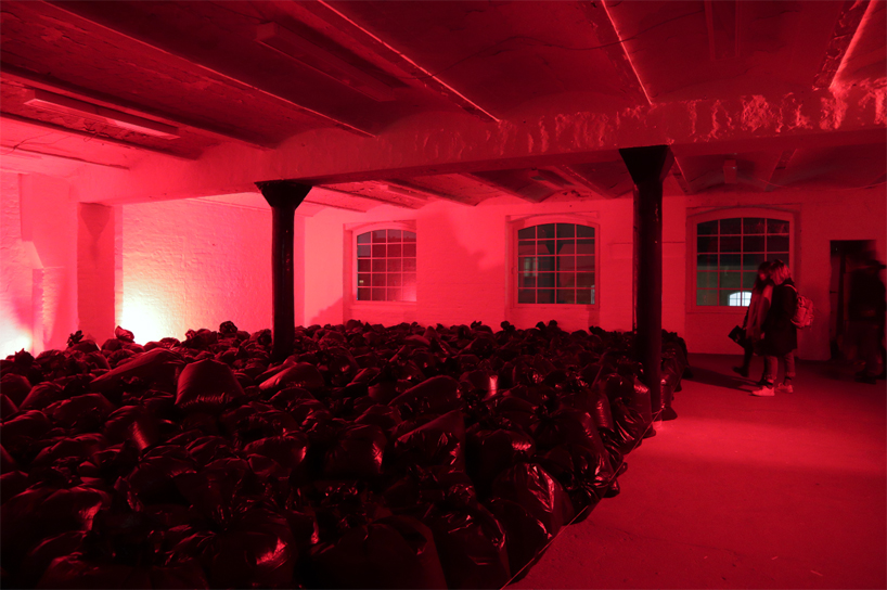 the krank installs 500 plastic trash bags in berlin to highlight our consumerist society designboom