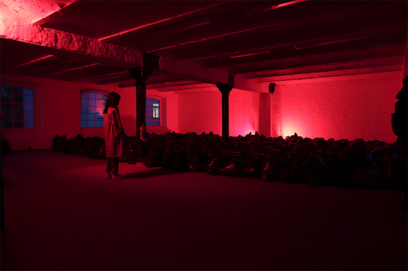 the krank installs 500 plastic trash bags in berlin to highlight our consumerist society designboom