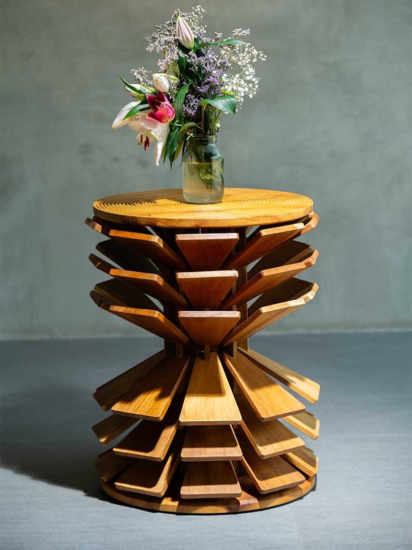salù iwadi studio layers spiraling wooden fins to form zangbeto side table - 3