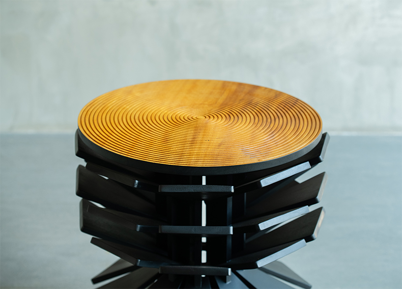salù iwadi studio layers spiraling wooden fins to form zangbeto side table - 5