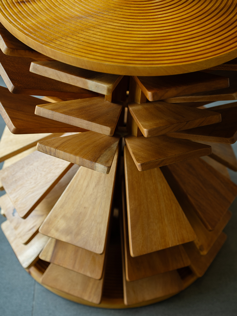 salù iwadi studio layers spiraling wooden fins to form zangbeto side table - 7