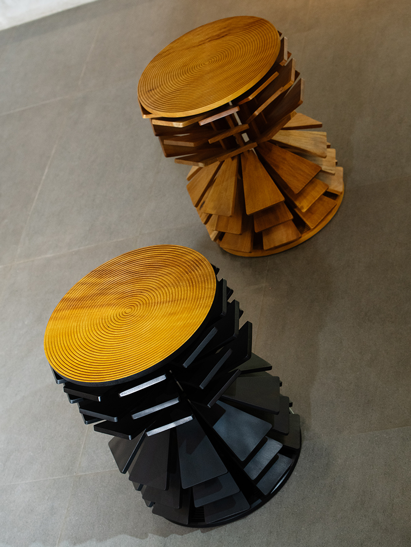 salù iwadi studio layers spiraling wooden fins to form zangbeto side table - 10