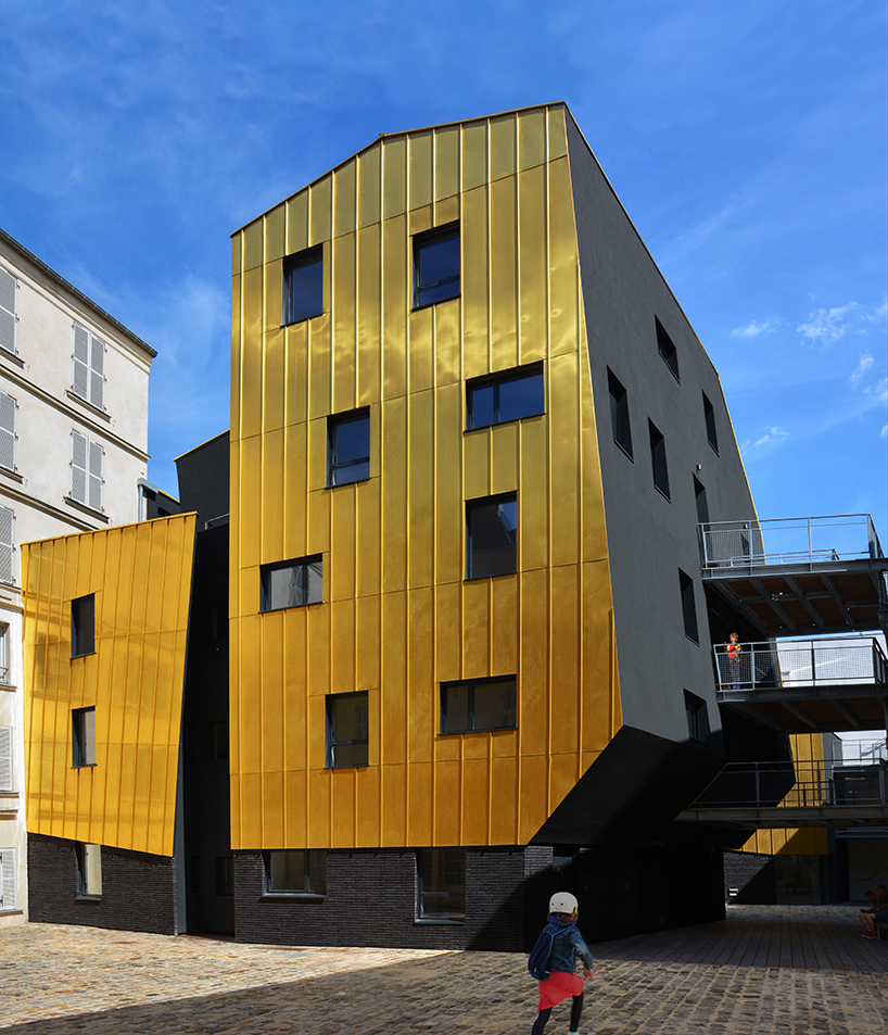golden standing seam panels clad metek architecture's social housing project in paris designboom