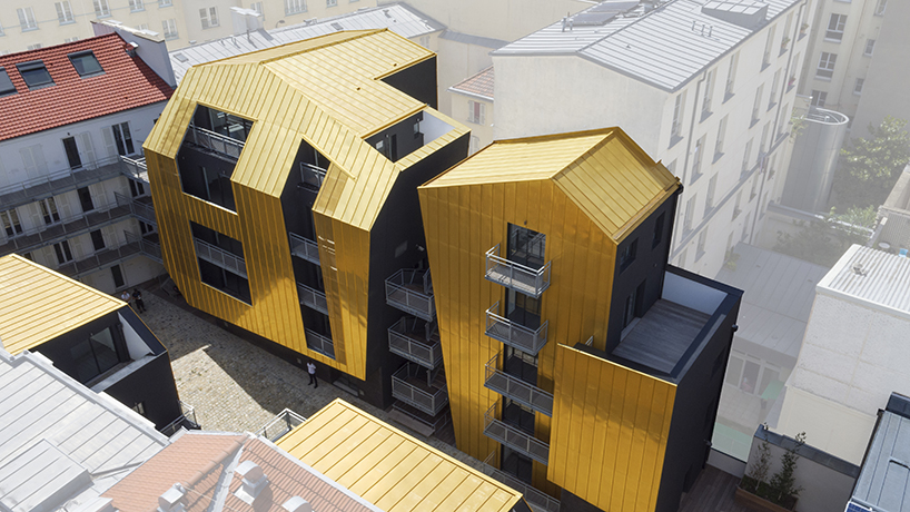 golden standing seam panels clad metek architecture's social housing project in paris designboom