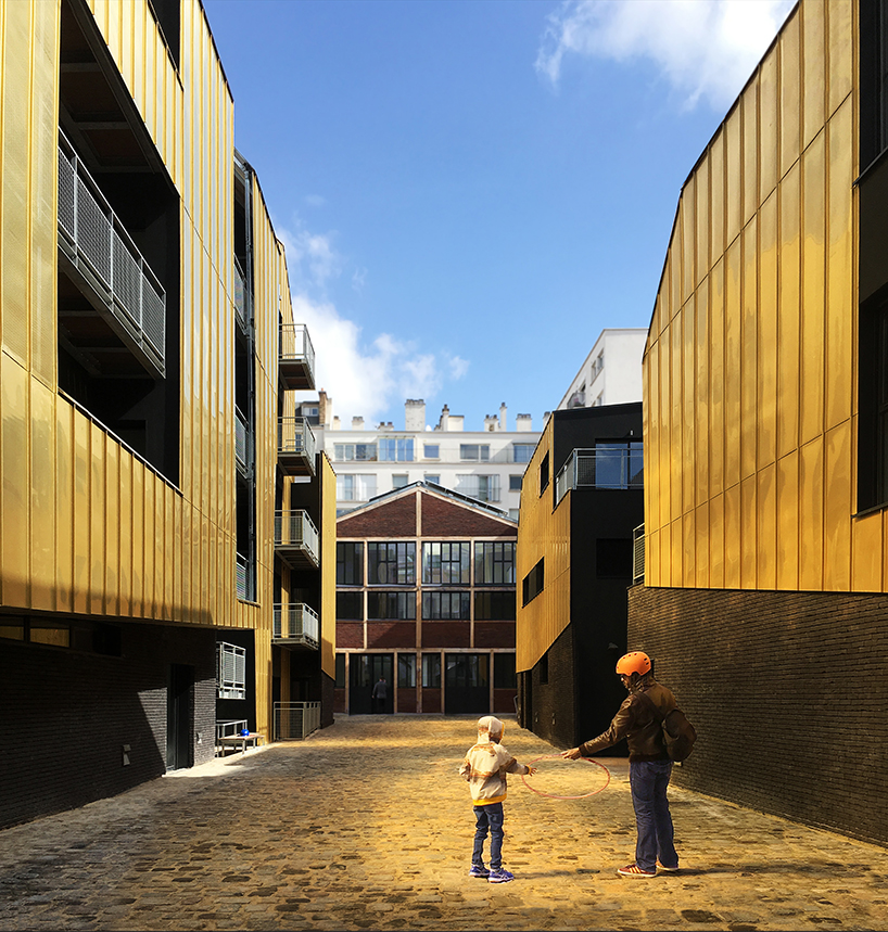 golden standing seam panels clad metek architecture's social housing project in paris designboom