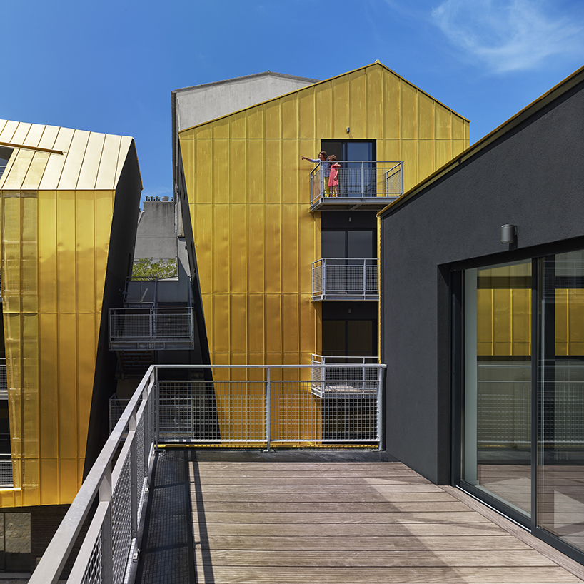 golden standing seam panels clad metek architecture's social housing project in paris designboom