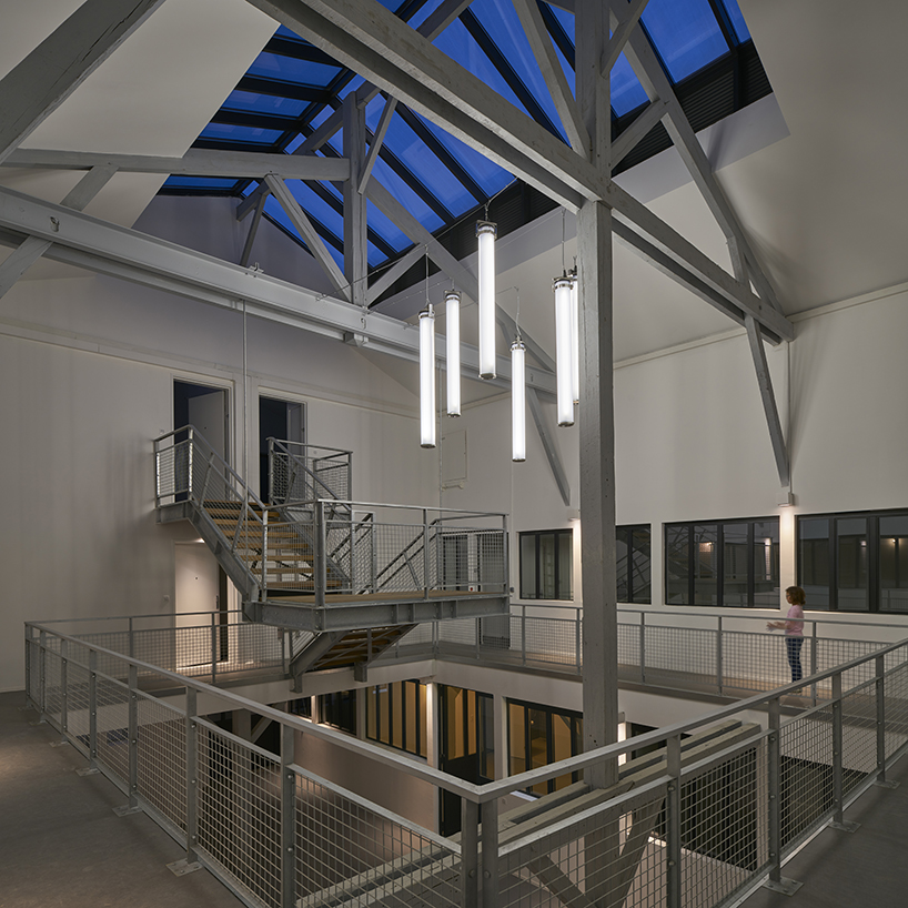 golden standing seam panels clad metek architecture's social housing project in paris designboom