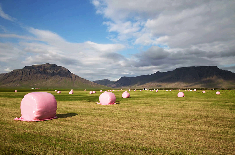 tobia zambotti stacks pink hay bales in rural iceland to raise awareness of breast cancer designboom