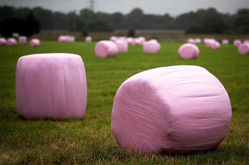 tobia zambotti stacks pink hay bales in rural iceland to raise awareness of breast cancer designboom