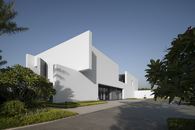 intersected white walls form geometric retail center + art gallery by aoe architects in china