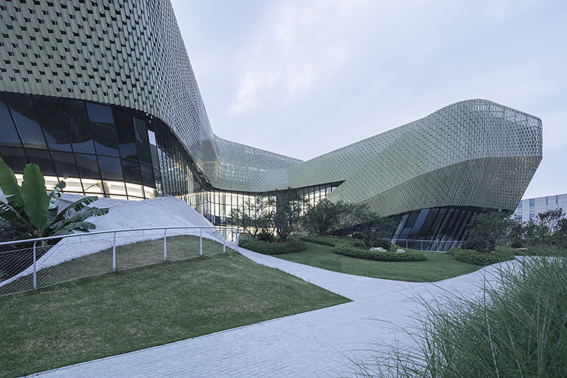 a textured ceramic skin clads playze + schmidhuber's exhibition center in china designboom