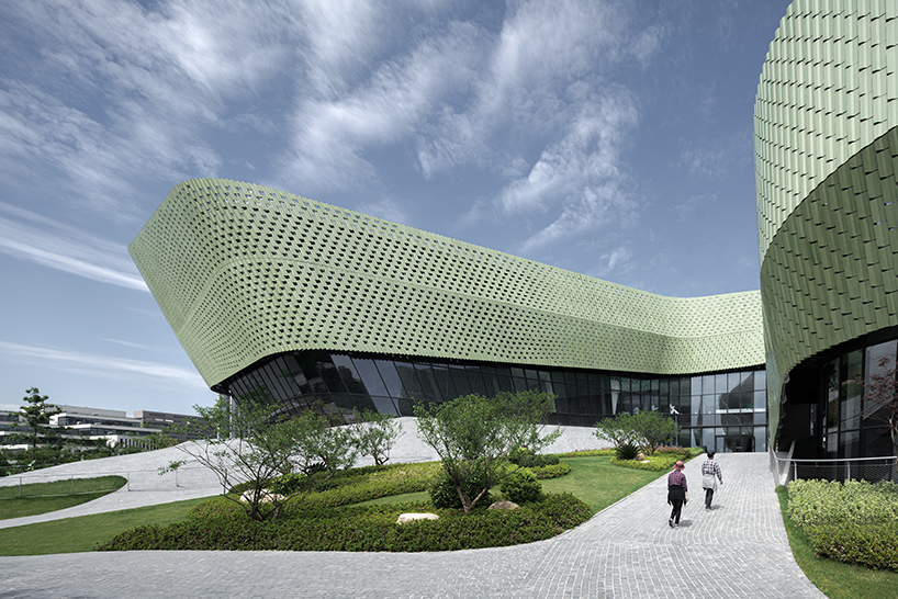 a textured ceramic skin clads playze + schmidhuber's exhibition center in china designboom