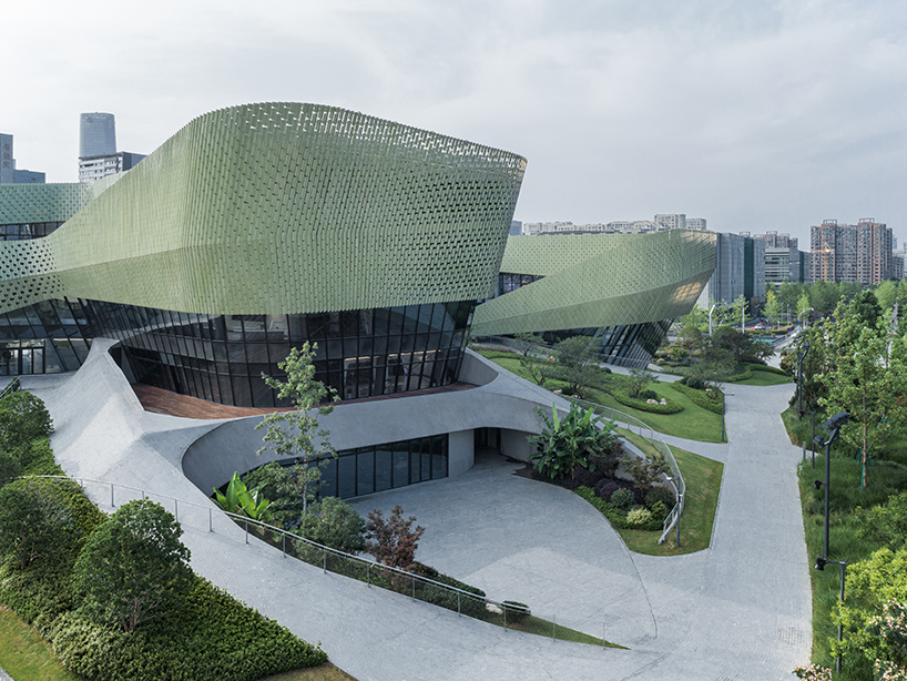 a textured ceramic skin clads playze + schmidhuber's exhibition center in china designboom