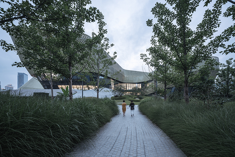 a textured ceramic skin clads playze + schmidhuber's exhibition center in china designboom