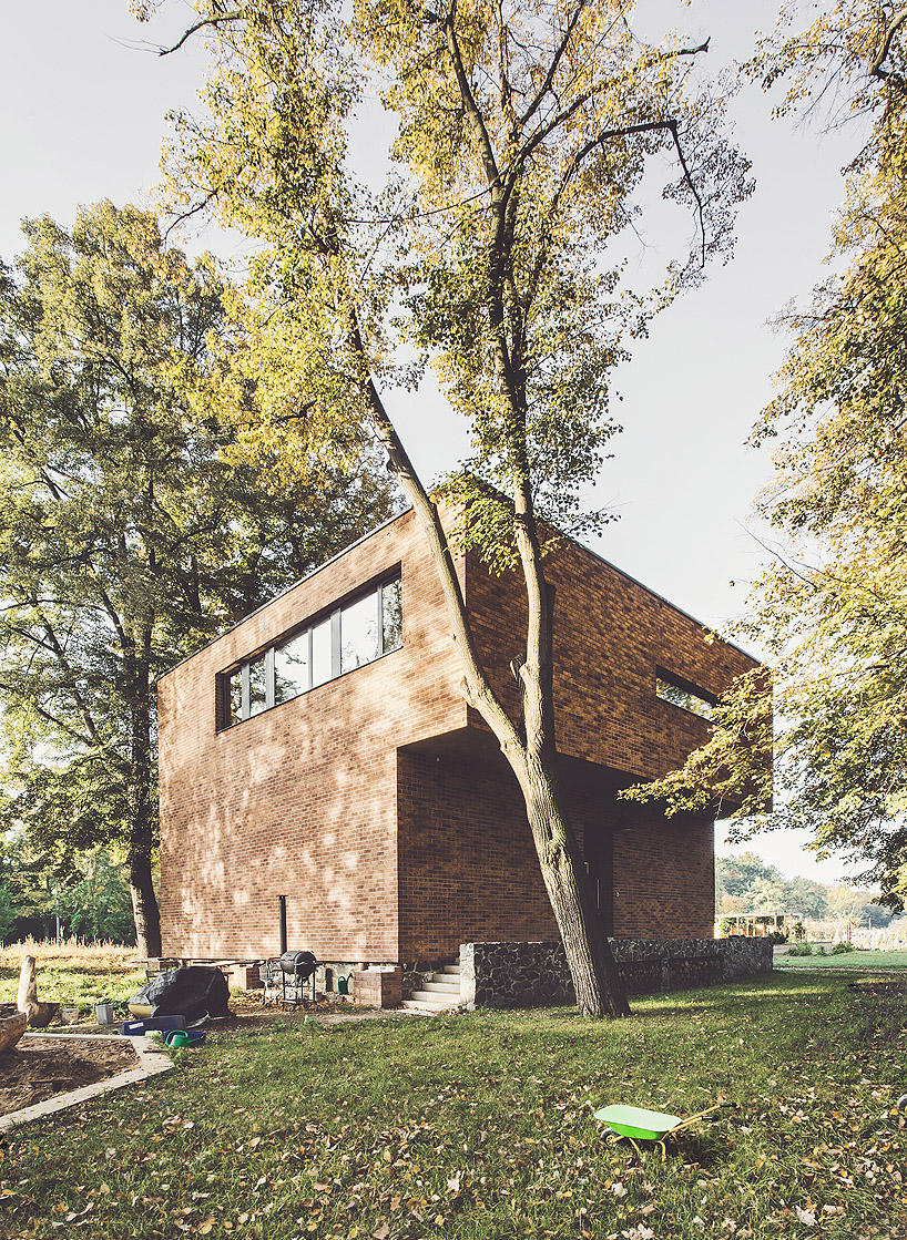 edit! renovates an old brick guardhouse to create a family home in prague designboom