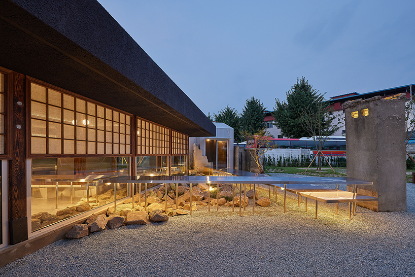 traditional wooden hanok roof frame tops nomal's renovated restaurant in korea - 6