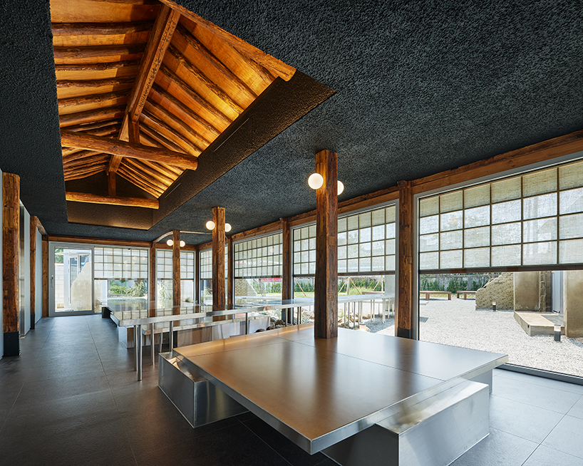 traditional wooden hanok roof frame tops nomal's renovated restaurant in korea - 2
